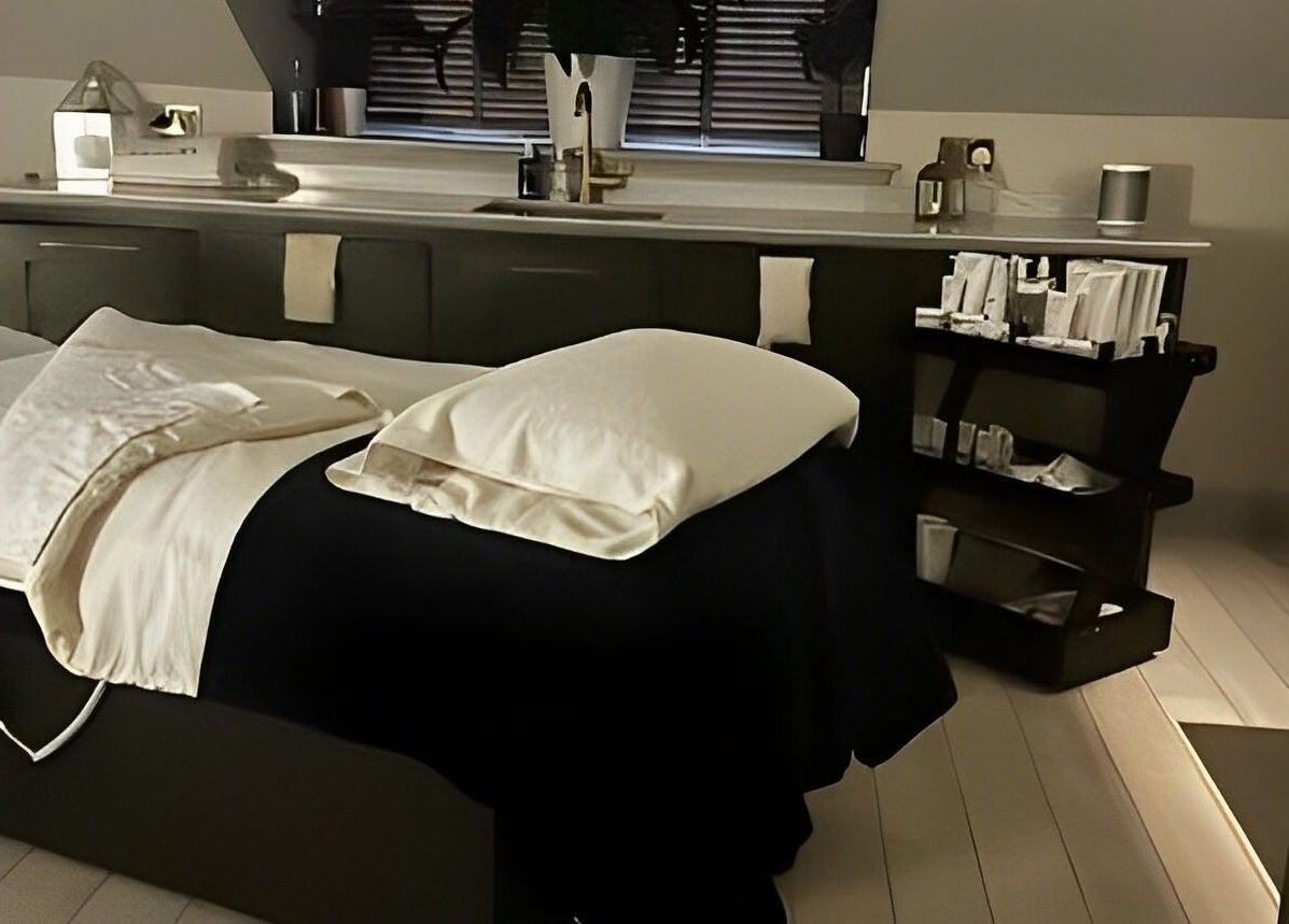 Tranquil treatment room at Spa on the Hill, North Berwick, Scotland, GB, featuring a cozy massage bed.