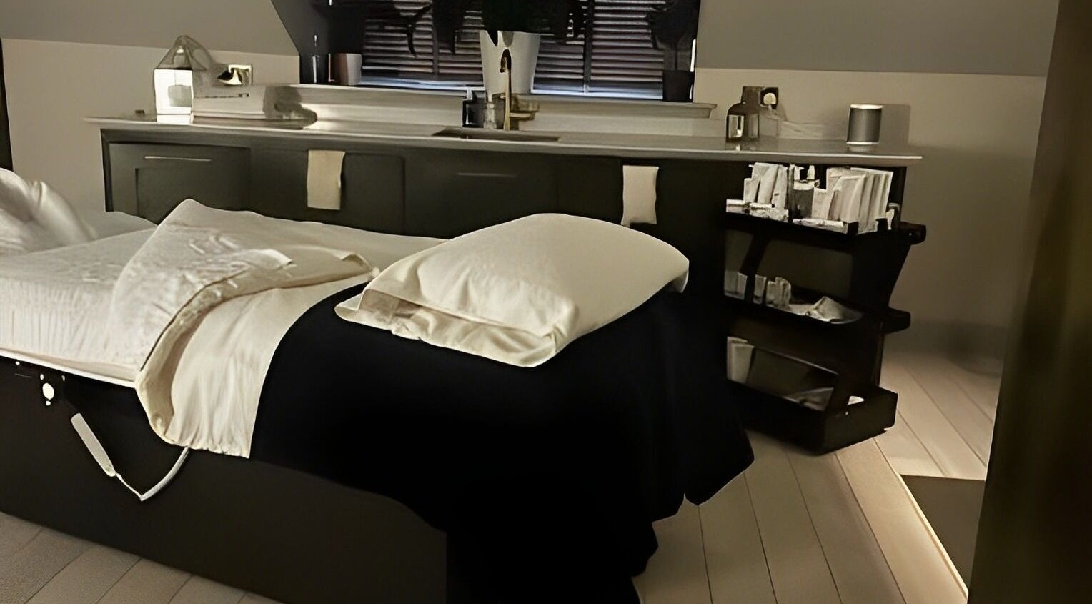 Tranquil treatment room at Spa on the Hill, North Berwick, Scotland, GB, featuring a cozy massage bed.
