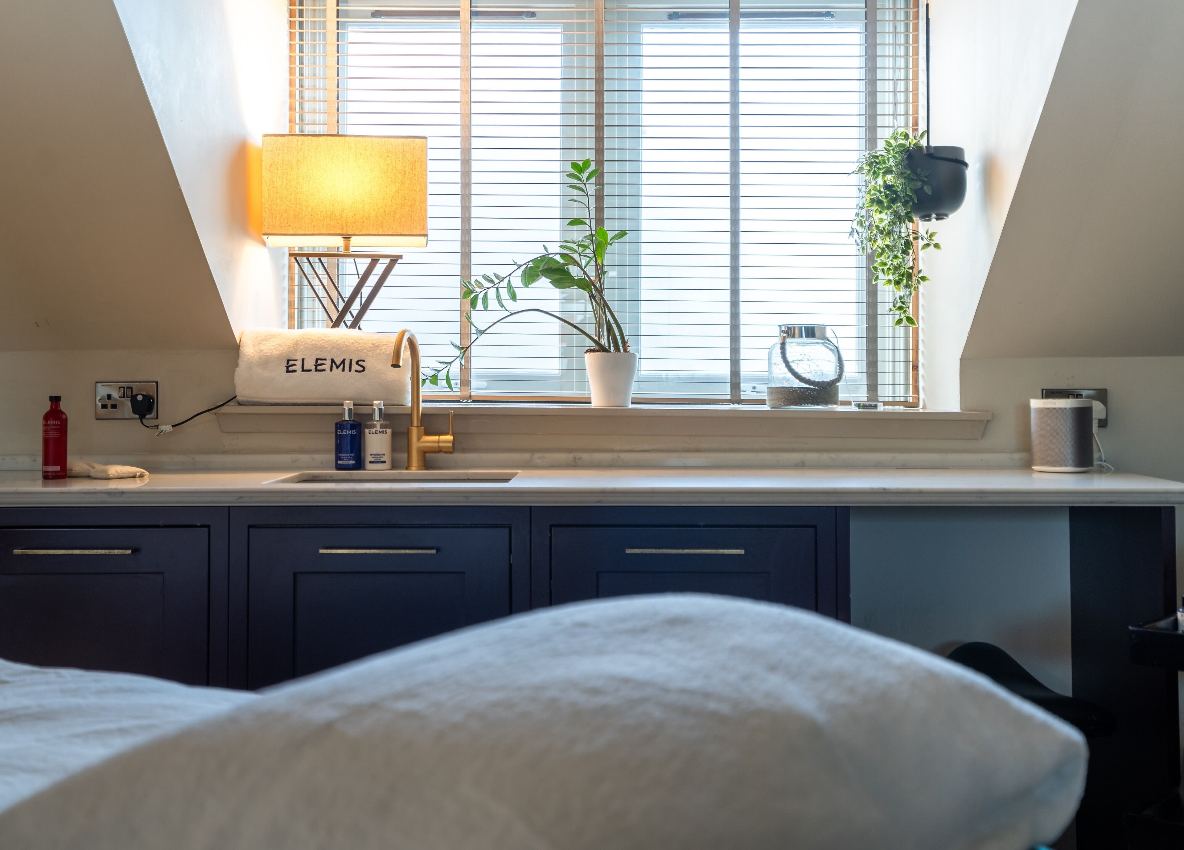 Relaxing treatment room at Spa on the Hill, North Berwick, Scotland, GB, with calming decor and spa products.