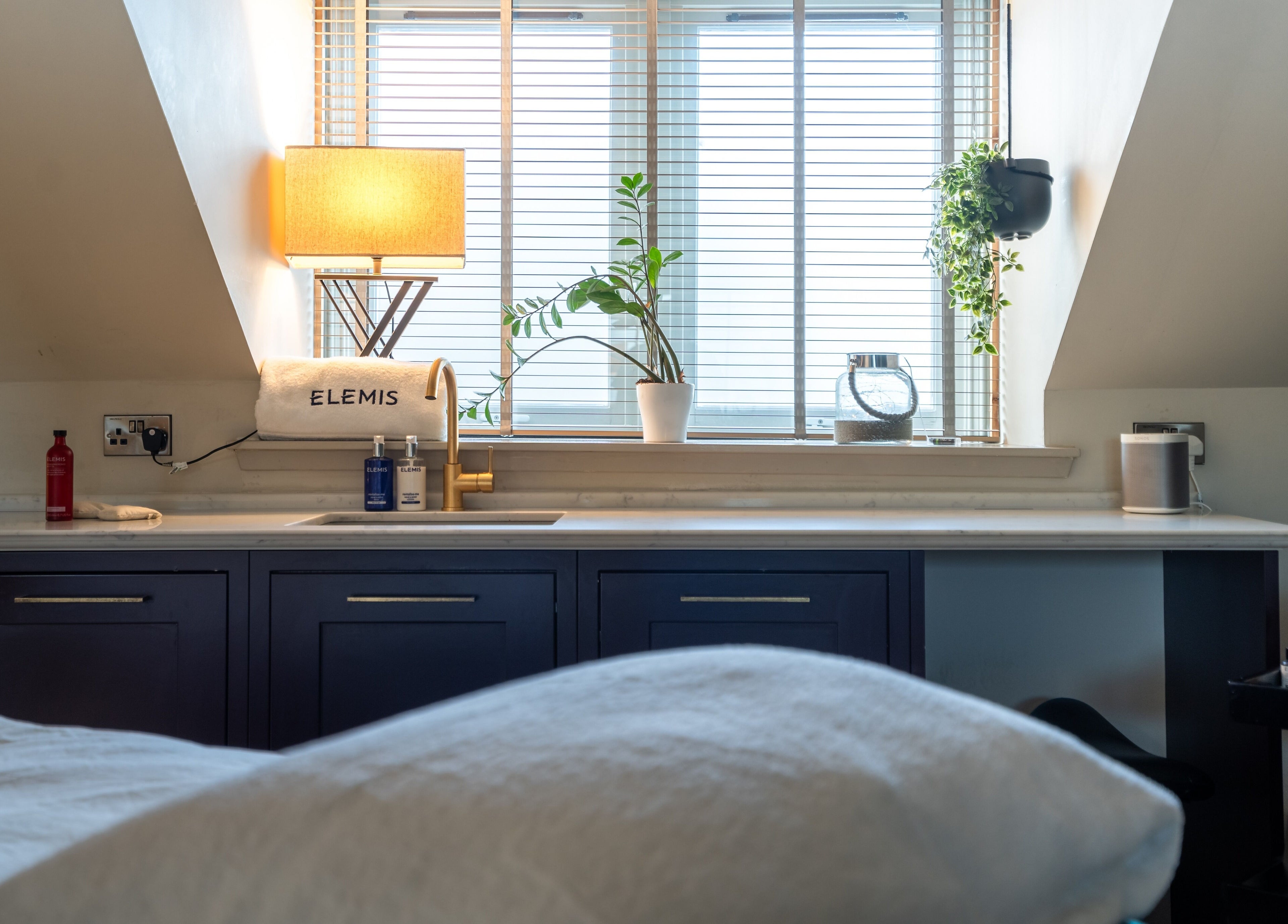 Relaxing treatment room at Spa on the Hill, North Berwick, Scotland, GB, with calming decor and spa products.