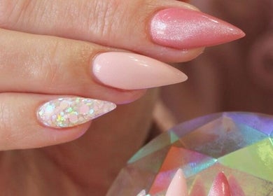 Stunning nail art with pink and glitter tips at Elysian Escape Day Spa, Germiston, Gauteng, ZA.