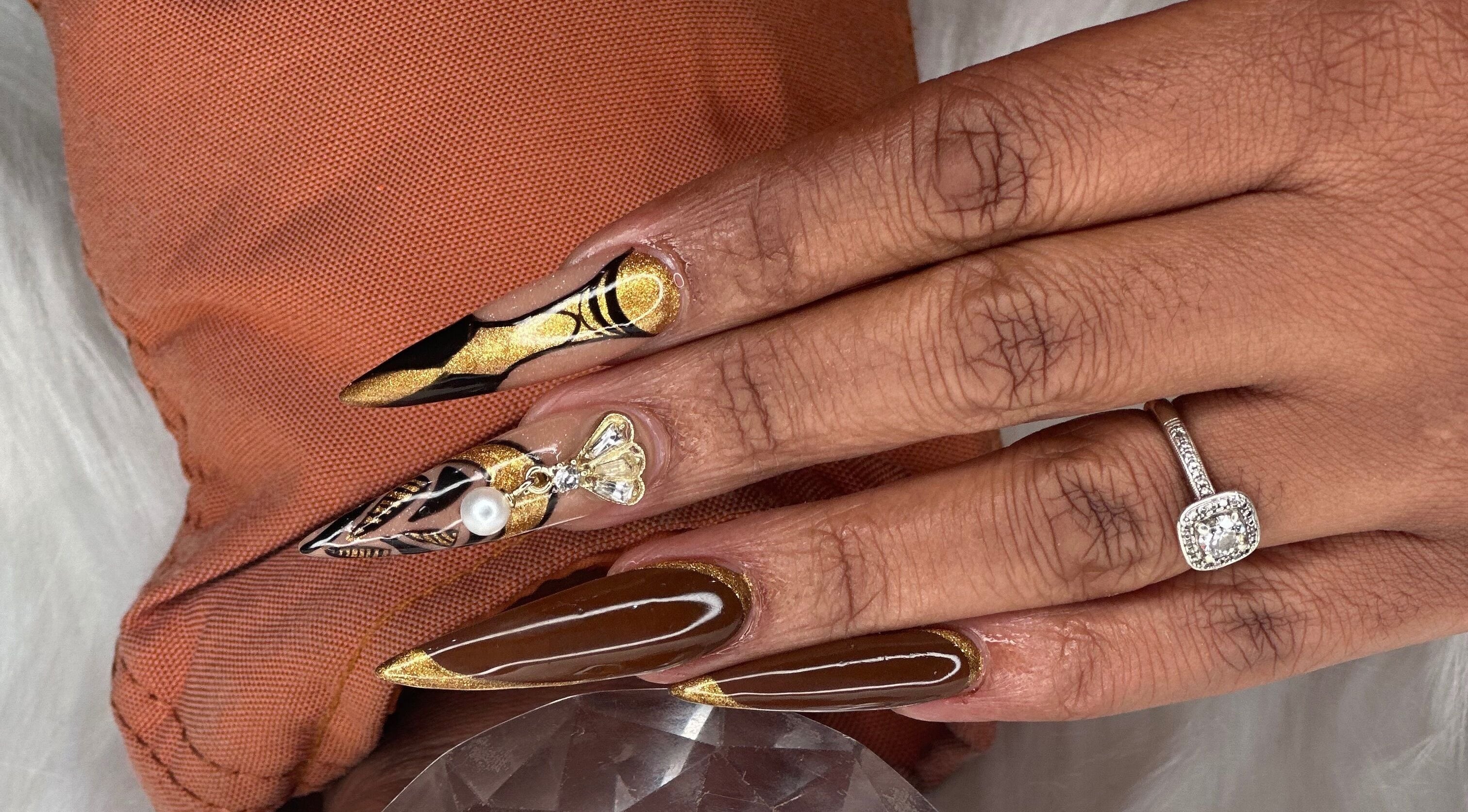 Intricate nail art with gold and pearl design at Elysian Escape Day Spa, Germiston, Gauteng, ZA.