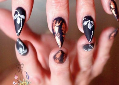 Elegant nail art design at Elysian Escape Day Spa, Germiston, Gauteng, ZA featuring black with floral details.