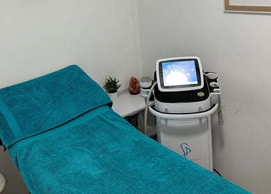 Cryotherapy room at The Cryo Lab, Whitefield, England, GB, featuring a treatment bed and advanced equipment.