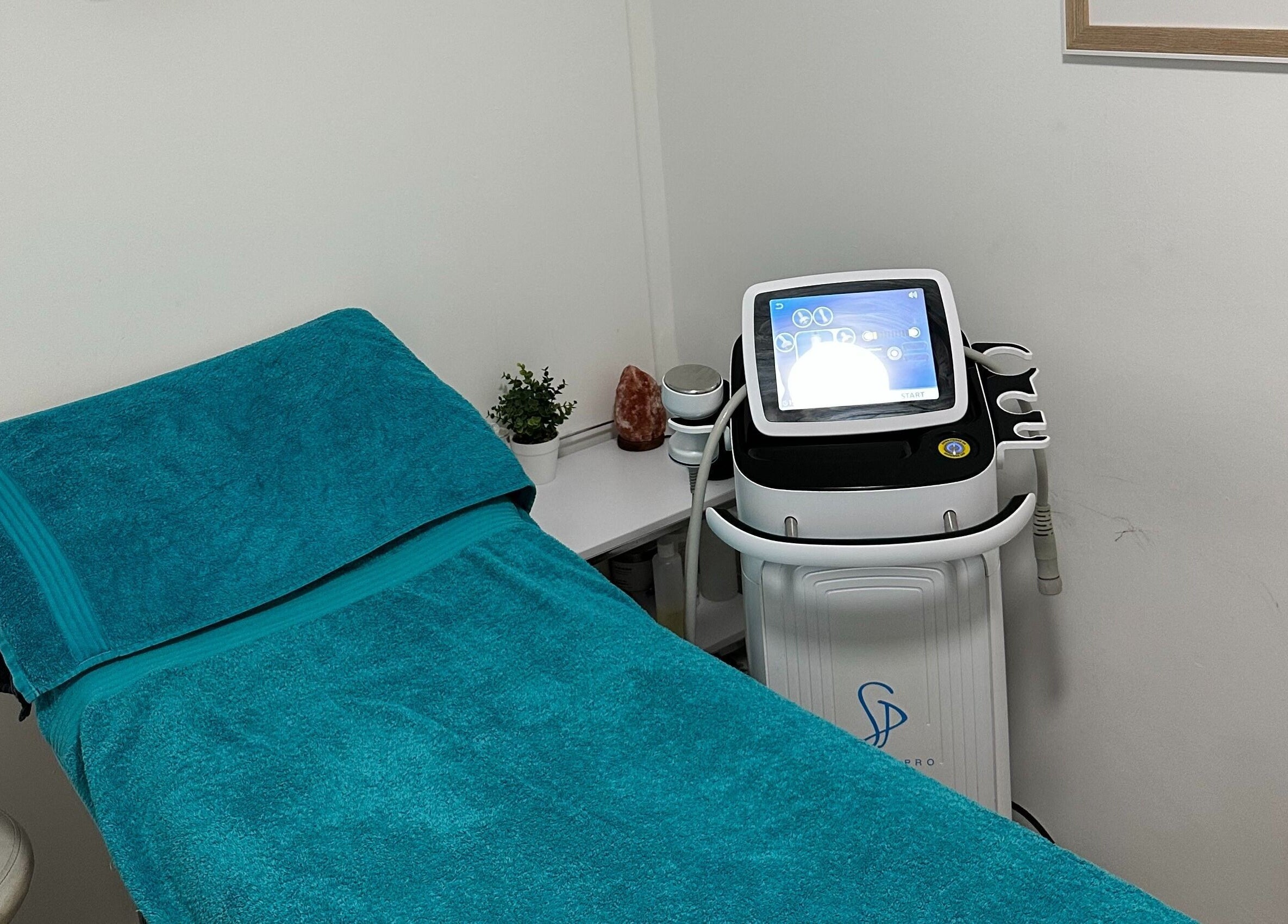 Cryotherapy room at The Cryo Lab, Whitefield, England, GB, featuring a treatment bed and advanced equipment.