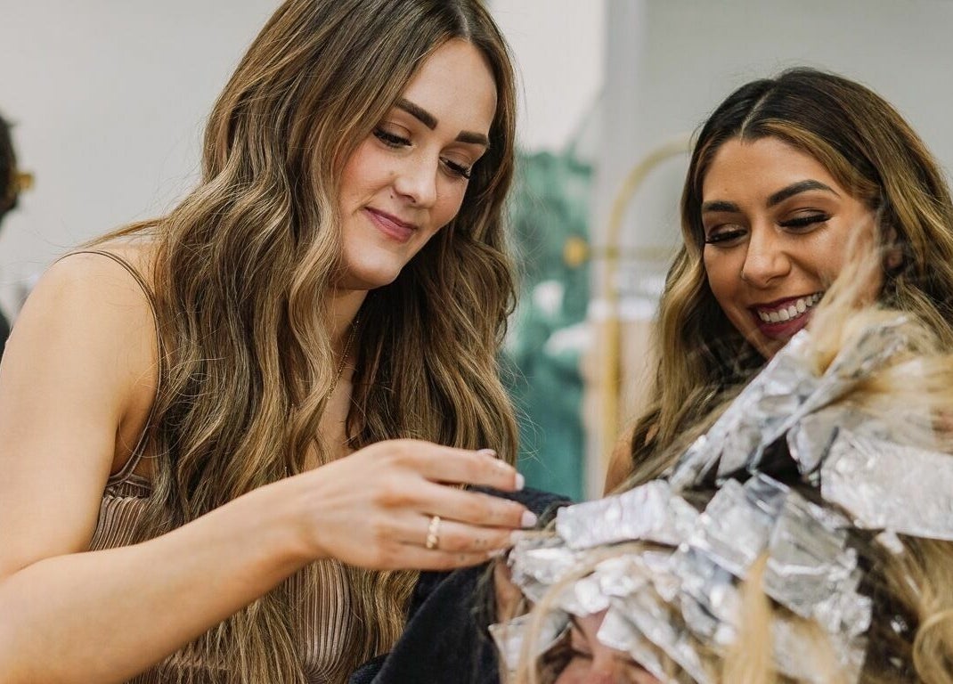 Hairstylist working on highlights at Whitefox Styling in Amarillo, Texas, US.