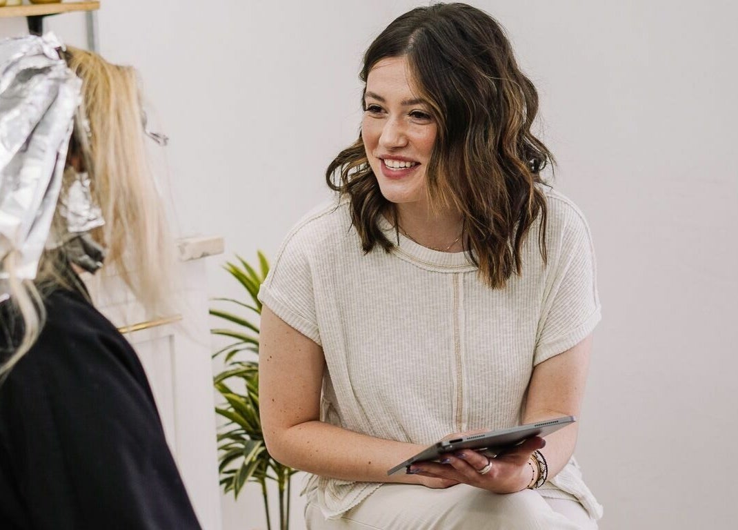 Stylist consulting client at Whitefox Styling, Amarillo, Texas, US for personalized beauty treatment.