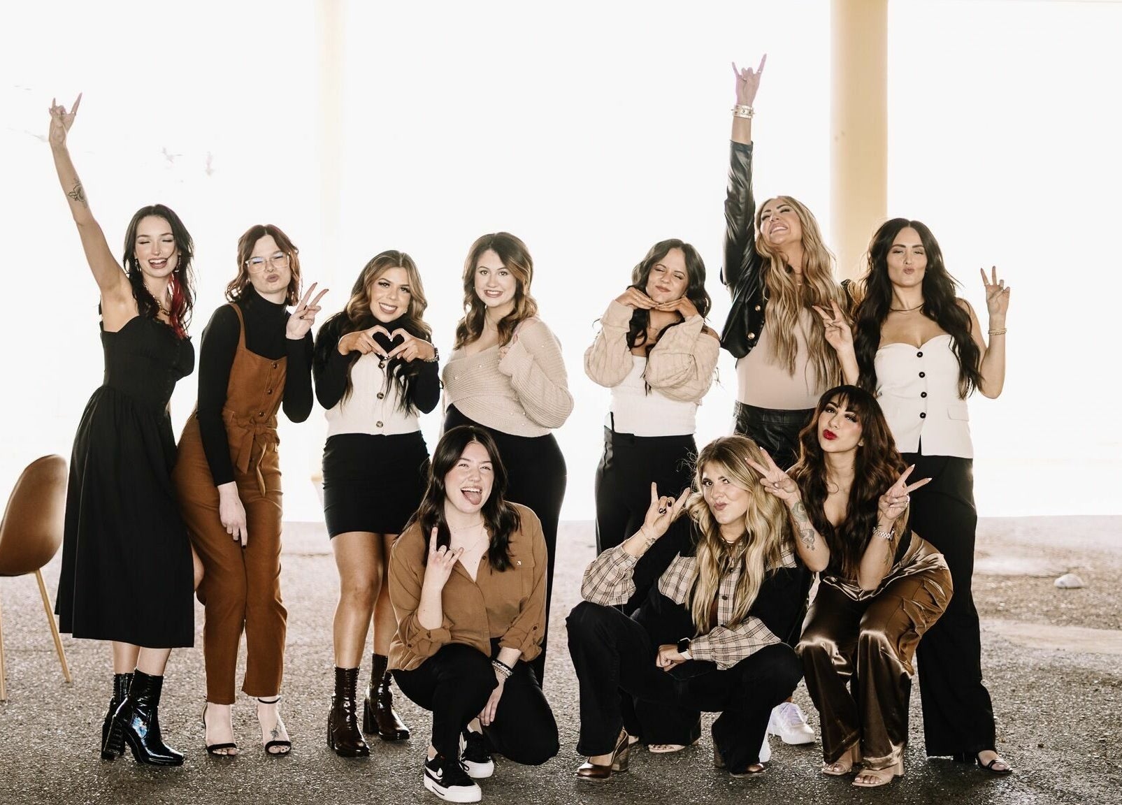 Staff at Whitefox Styling, Amarillo, Texas, US, radiating joy and unity in a chic group pose.