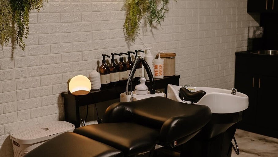 Luxurious wash station at Mirrored by Melissa, Webster, NY. Elegant setup enhances salon experience.