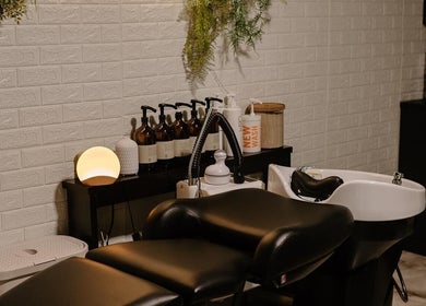 Luxurious wash station at Mirrored by Melissa, Webster, NY. Elegant setup enhances salon experience.