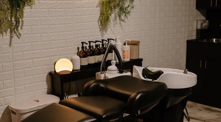 Luxurious wash station at Mirrored by Melissa, Webster, NY. Elegant setup enhances salon experience.