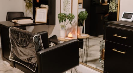 Modern salon chair and decor at Mirrored by Melissa, Webster, New York, US, offering a chic atmosphere.