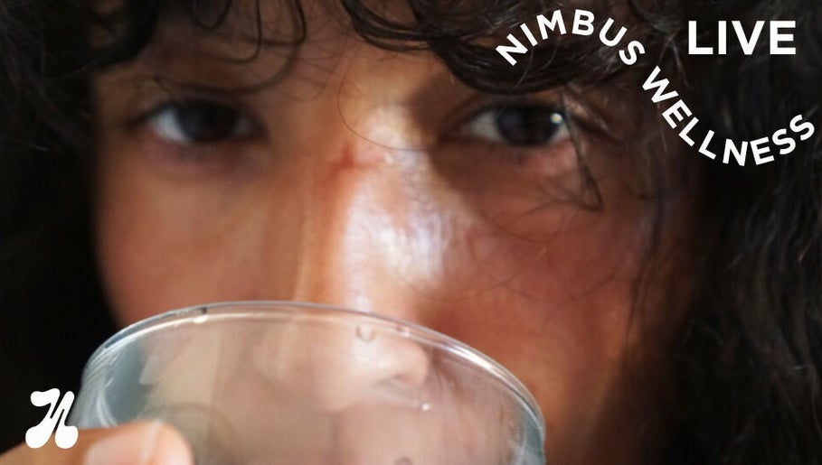 Close-up of a person drinking at Nimbus Live, Waterloo, New South Wales, AU. Experience wellness and refreshment.