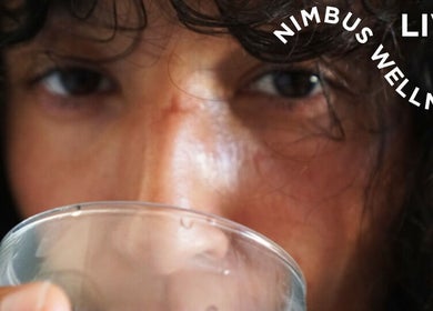 Close-up of a person drinking at Nimbus Live, Waterloo, New South Wales, AU. Experience wellness and refreshment.