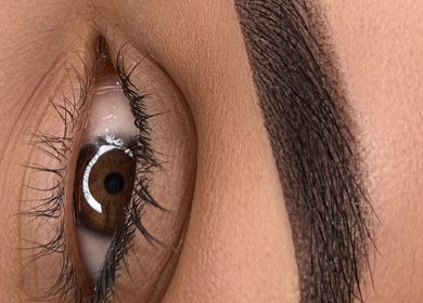 Detailed eyebrow styling at Lash and PMU Academy, Reading, England, GB. Expert precision and care shown.