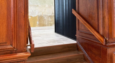 Elegant wooden staircase and paneling at Charlie Perry Skin in London, England, GB.