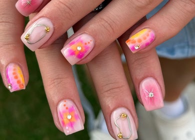 Vibrant nail art design at Nailed It by Amelia, Cheslyn Hay, England, GB showcasing colorful nails with floral patterns.