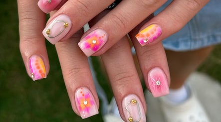 Vibrant nail art design at Nailed It by Amelia, Cheslyn Hay, England, GB showcasing colorful nails with floral patterns.