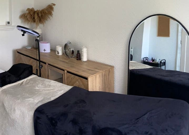 Cozy treatment room at Lashes & Brows By Lil, Hoddesdon, England, GB with modern decor and soft bedding.