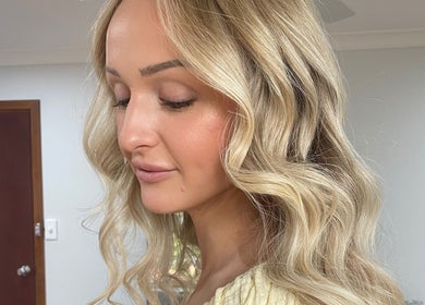 Elegant blonde waves hairstyle at Kalon Hair Perth, located in Perth, Western Australia, AU.