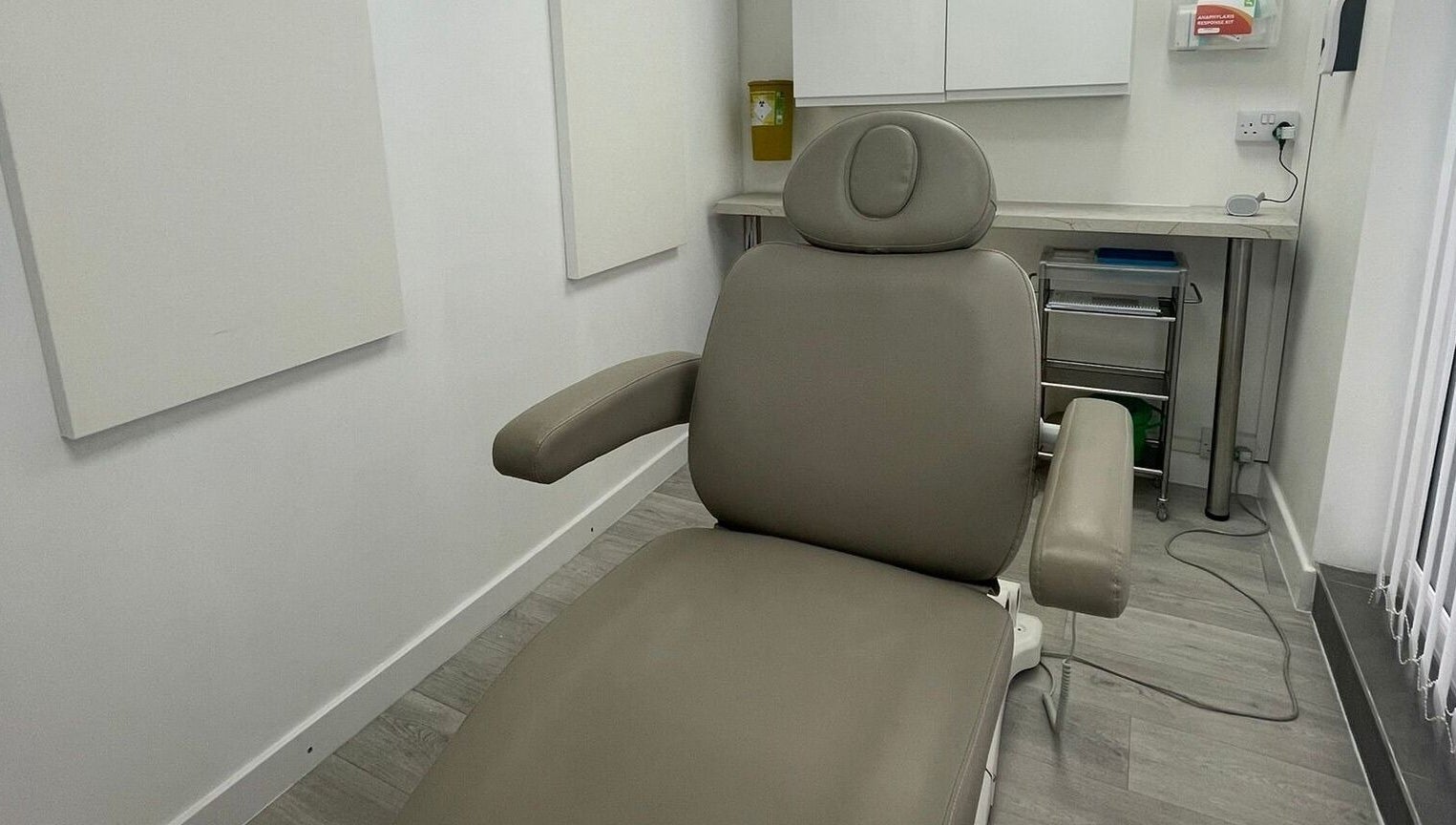 Modern treatment room at The Nurses Clinic, Nuneaton, England, GB with a plush reclining chair.