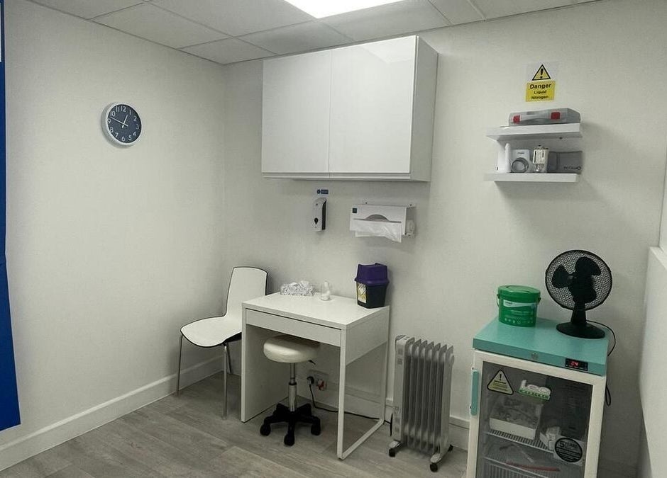 Bright clinical room at The Nurses Clinic, Nuneaton, England, GB, featuring essential medical equipment.