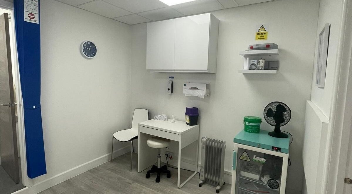 Bright clinical room at The Nurses Clinic, Nuneaton, England, GB, featuring essential medical equipment.