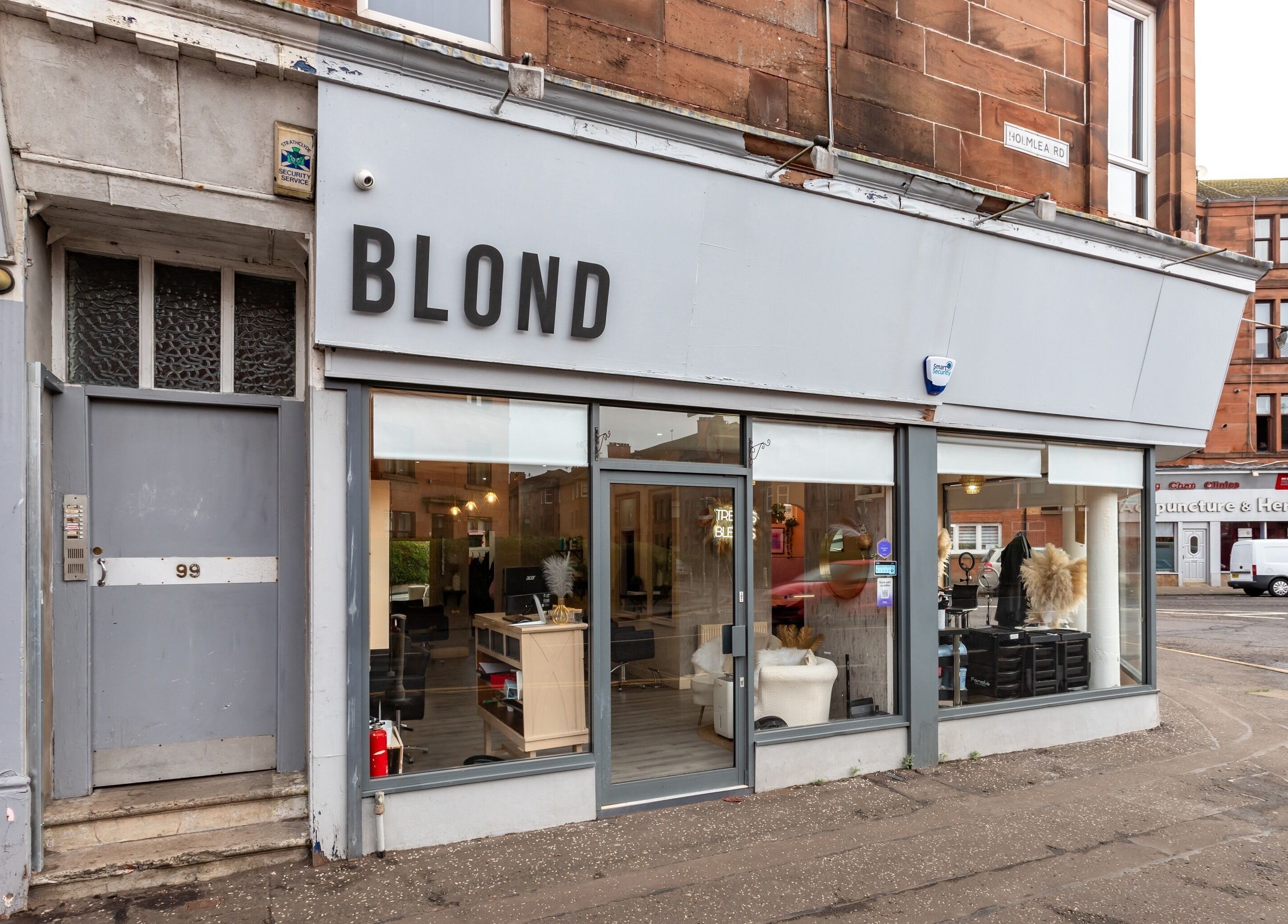Exterior view of BLOND Salon in Glasgow, Scotland, GB showcasing its stylish street presence.