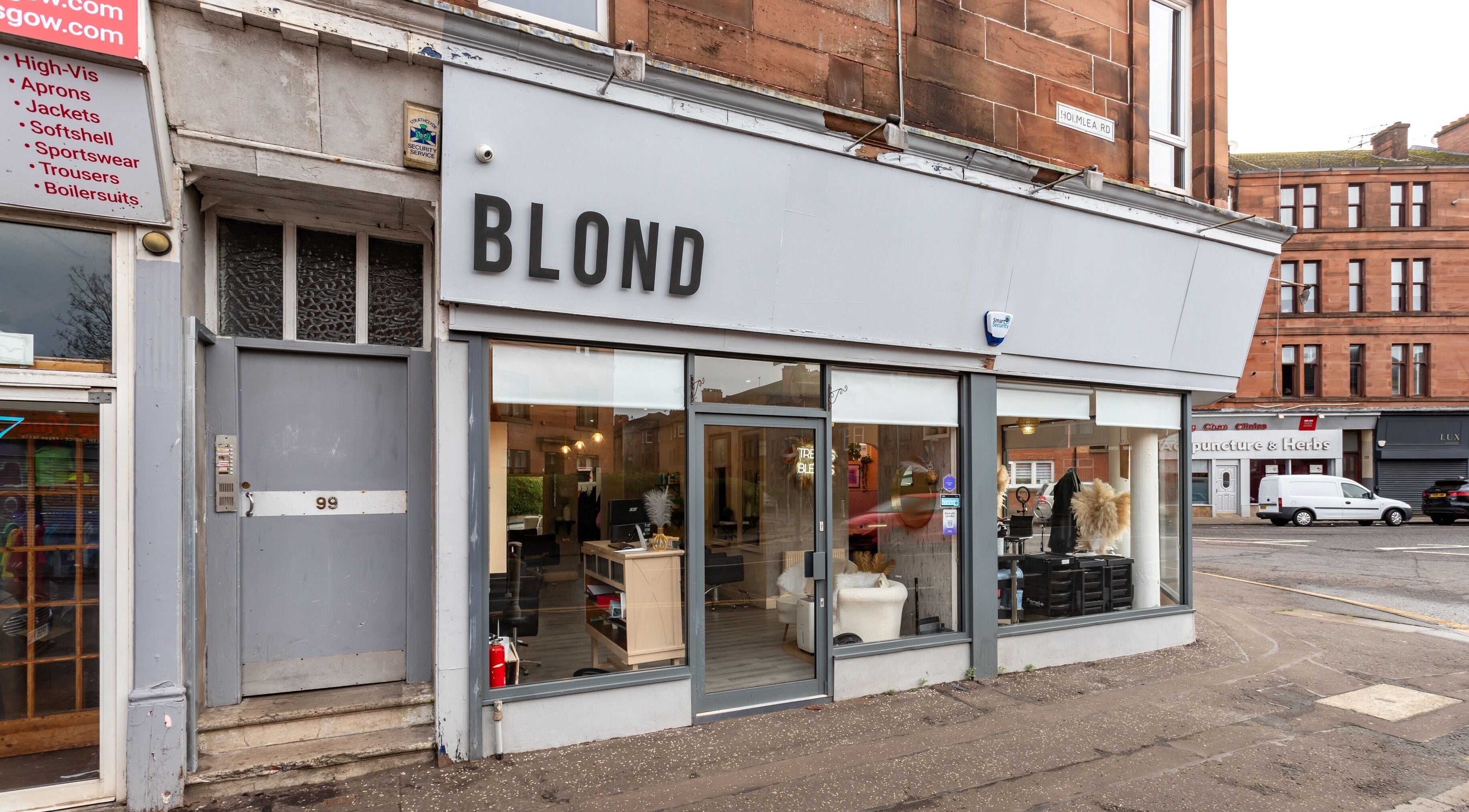 Exterior view of BLOND Salon in Glasgow, Scotland, GB showcasing its stylish street presence.