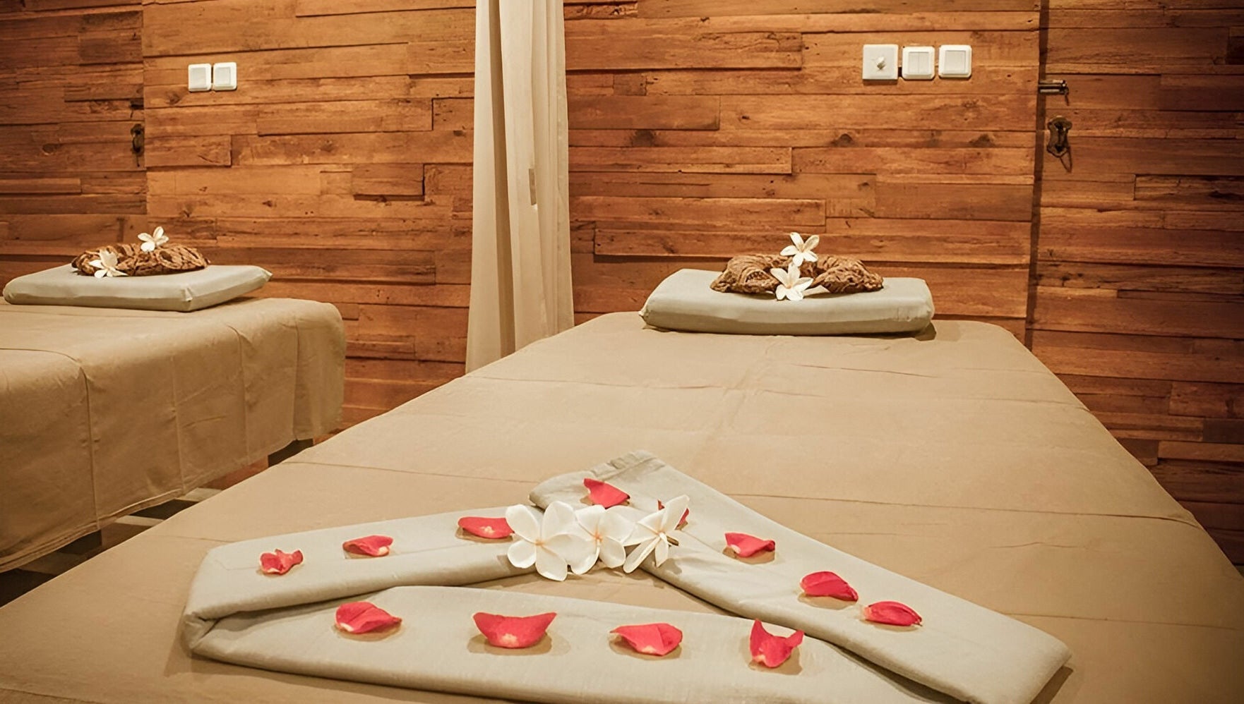 Relaxing treatment room at Laniakea Spa in Bali, Bali, ID, featuring serene decor and calming ambiance.
