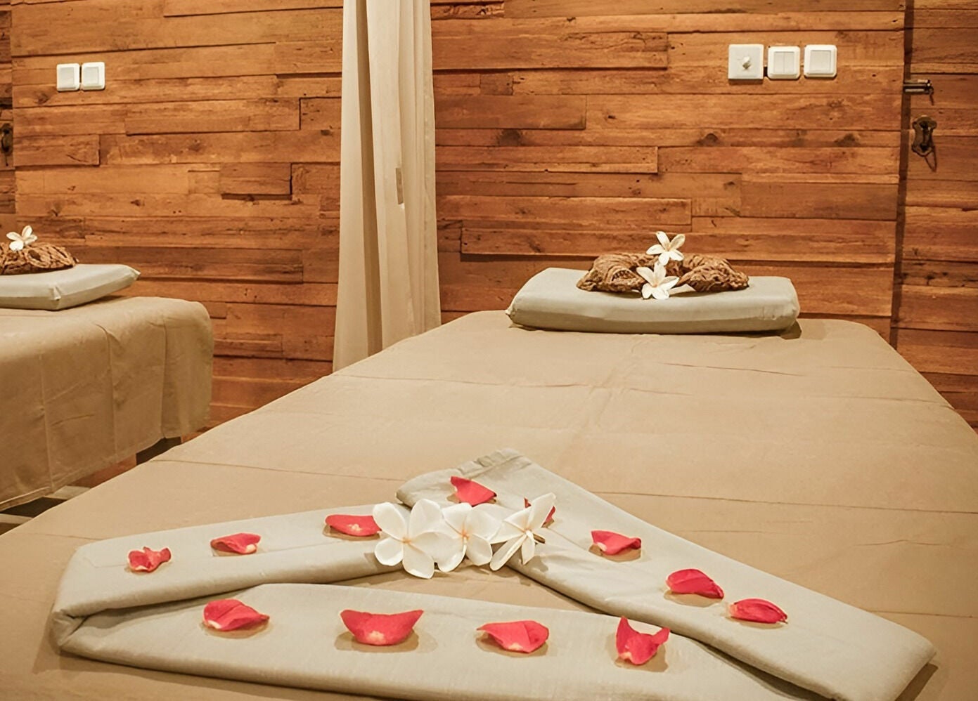 Relaxing treatment room at Laniakea Spa in Bali, Bali, ID, featuring serene decor and calming ambiance.