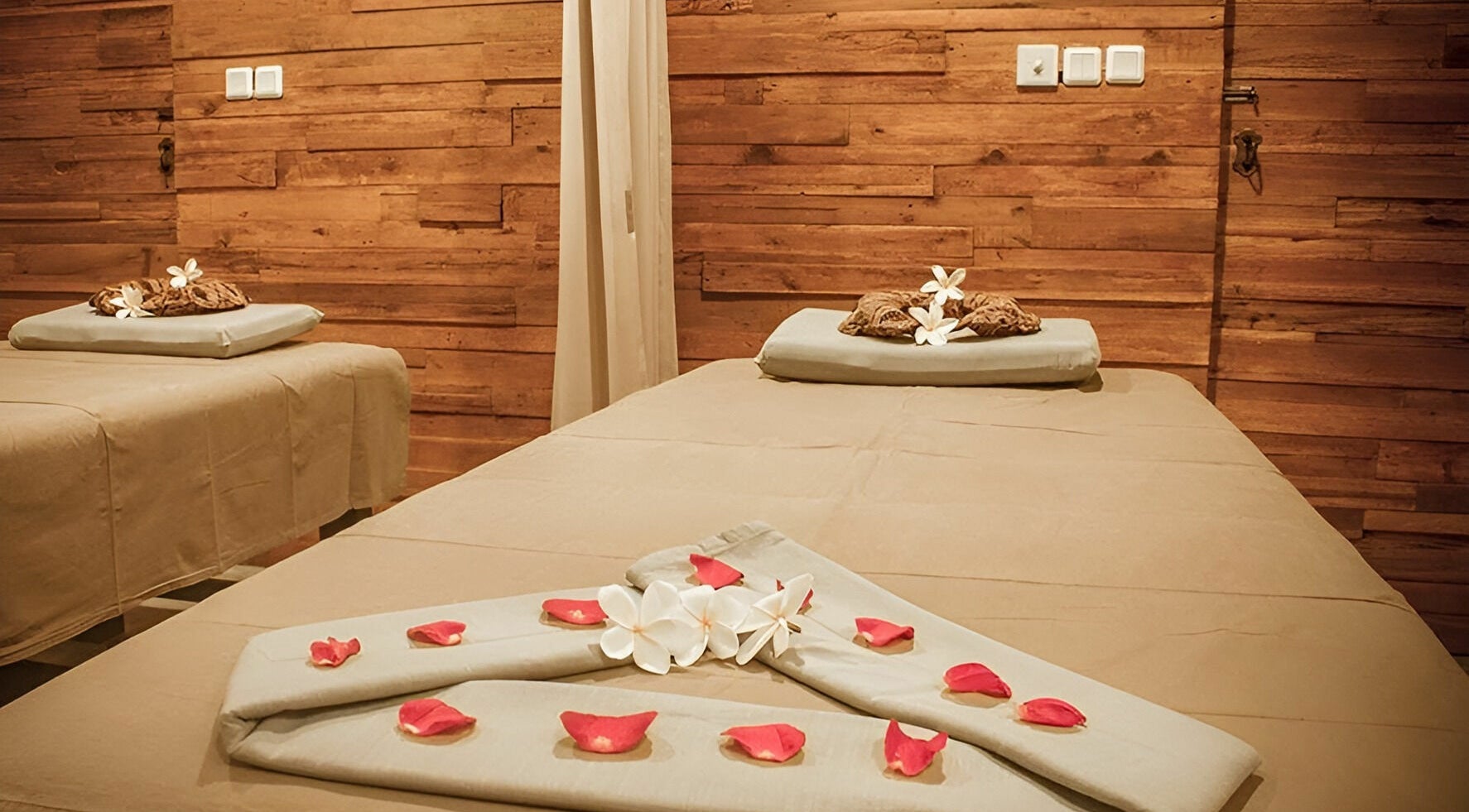 Relaxing treatment room at Laniakea Spa in Bali, Bali, ID, featuring serene decor and calming ambiance.