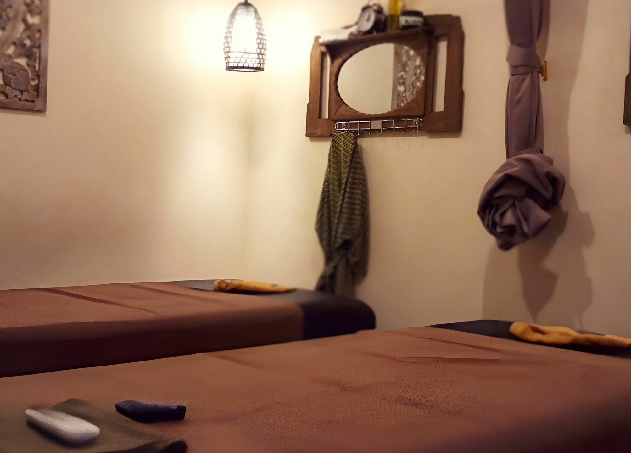 Relaxing massage room at Laniakea Spa, Bali, Bali, ID with two massage beds under warm lighting.