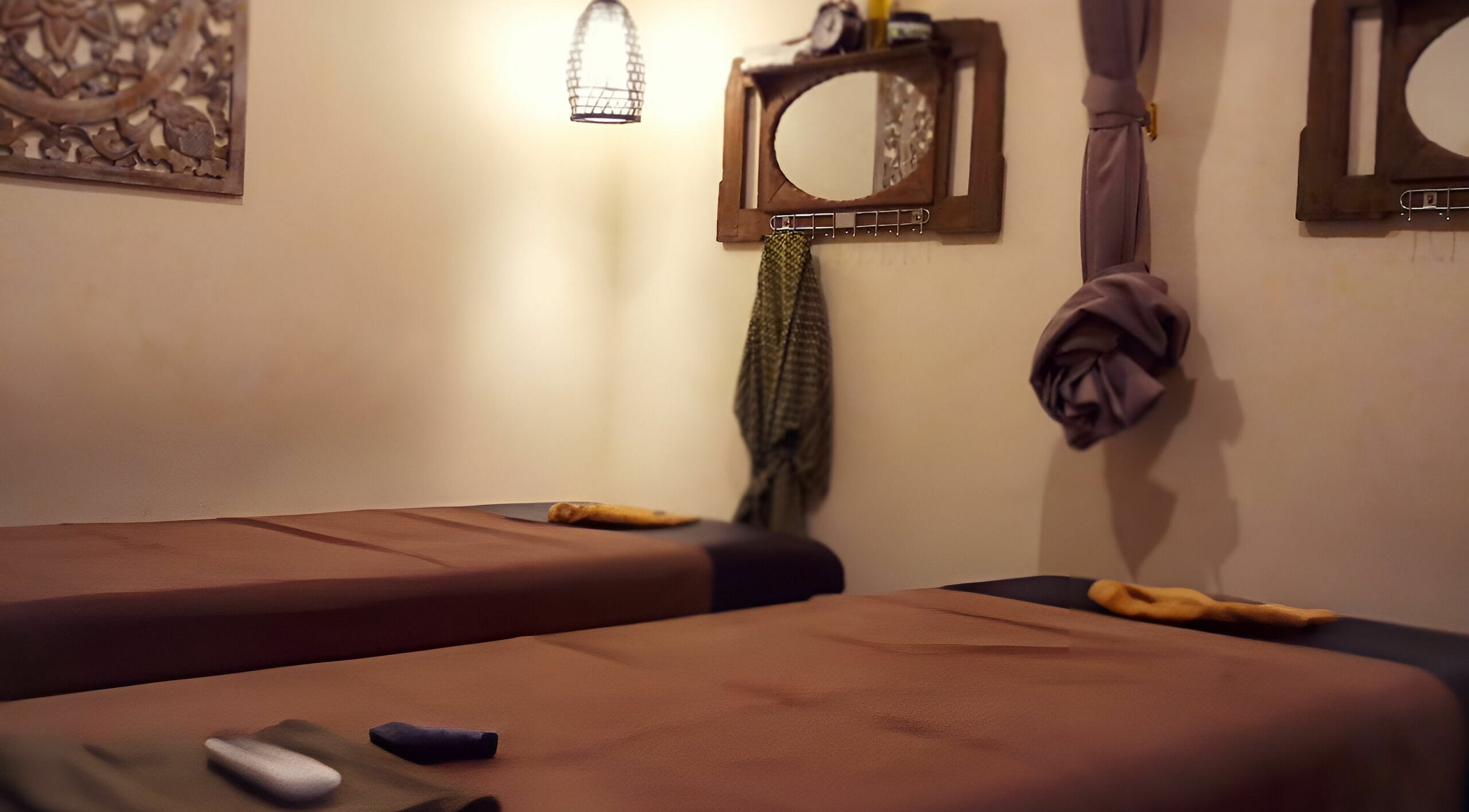 Relaxing massage room at Laniakea Spa, Bali, Bali, ID with two massage beds under warm lighting.