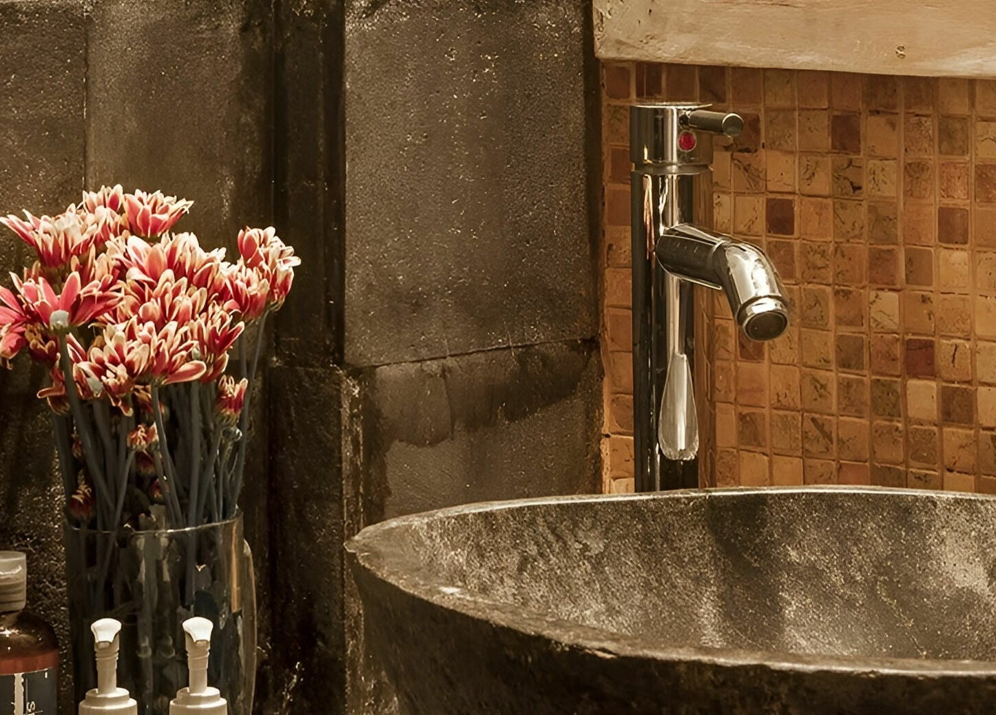 Elegant stone sink with floral decor at Laniakea Spa, Bali, Bali, ID showcasing tranquility.