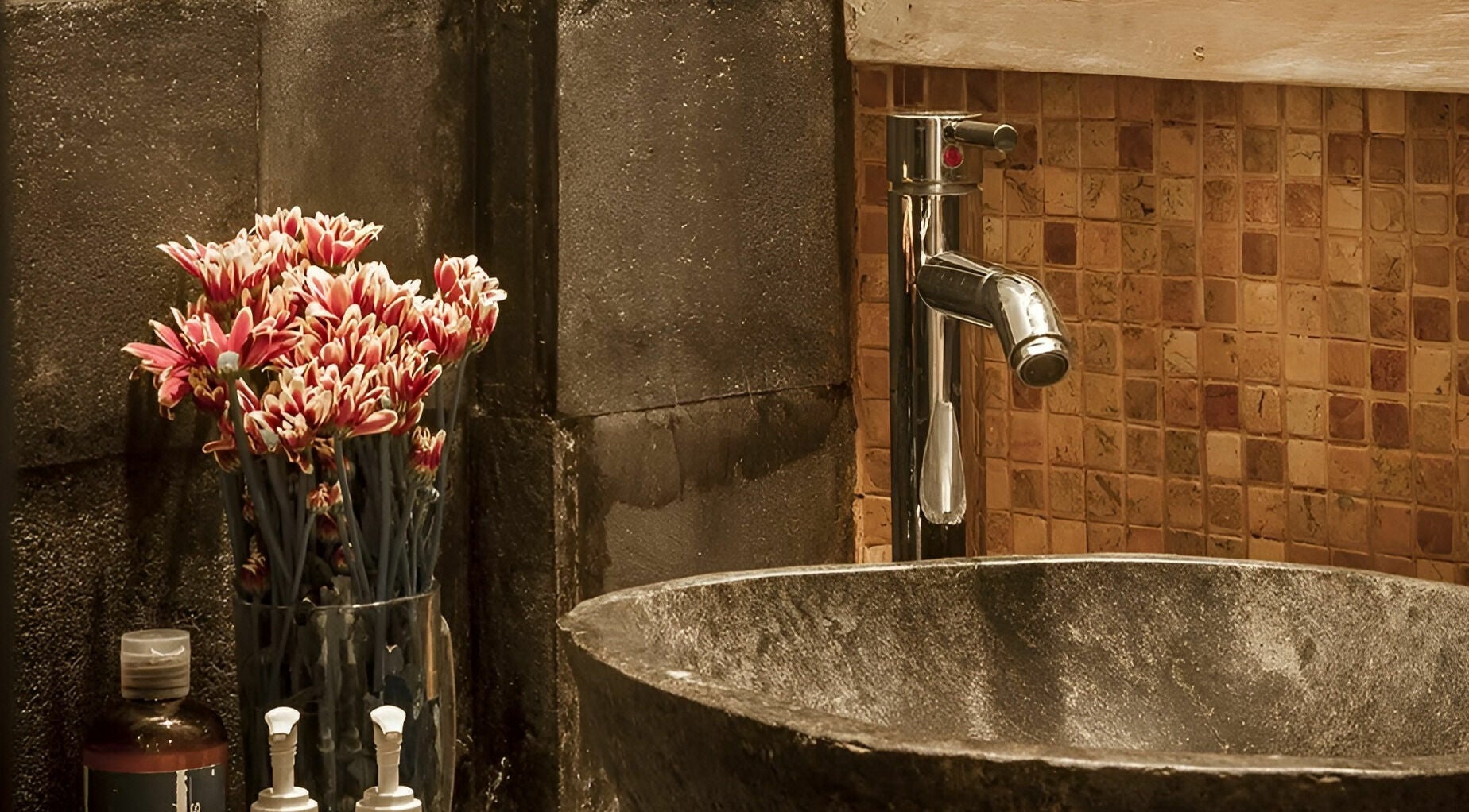 Elegant stone sink with floral decor at Laniakea Spa, Bali, Bali, ID showcasing tranquility.