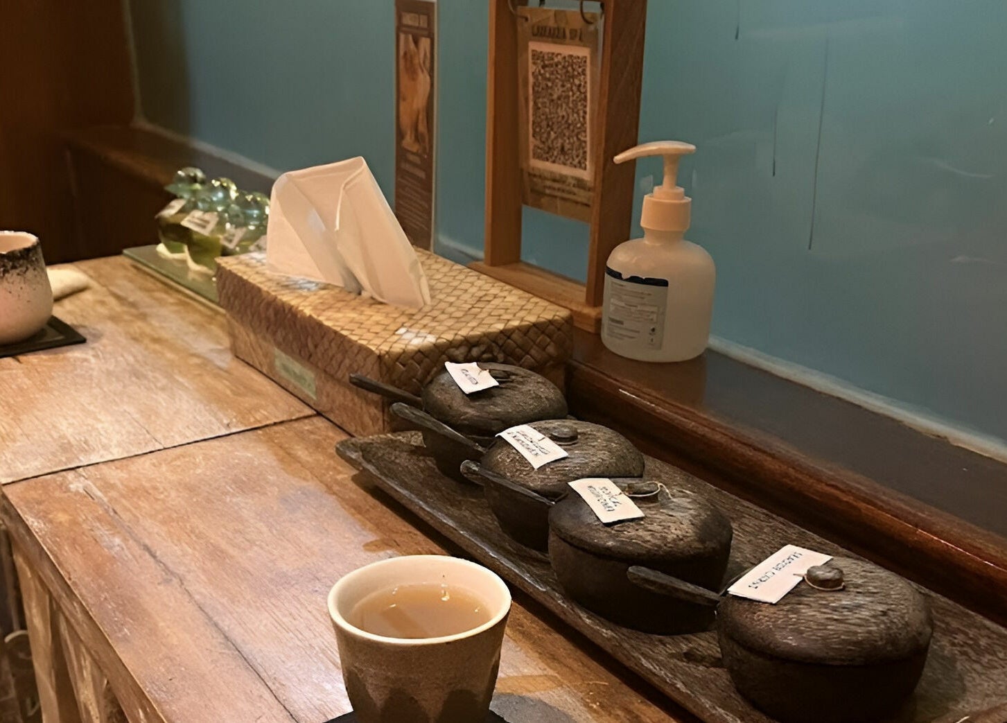 Relaxing tea setup at Laniakea Spa, Bali, Bali, ID with essential oils and elegant decor.
