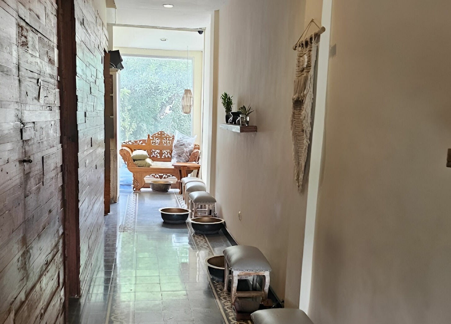 Elegant hallway with rustic decor at Laniakea Spa, Bali, Bali, ID, leading to a relaxing lounge area.