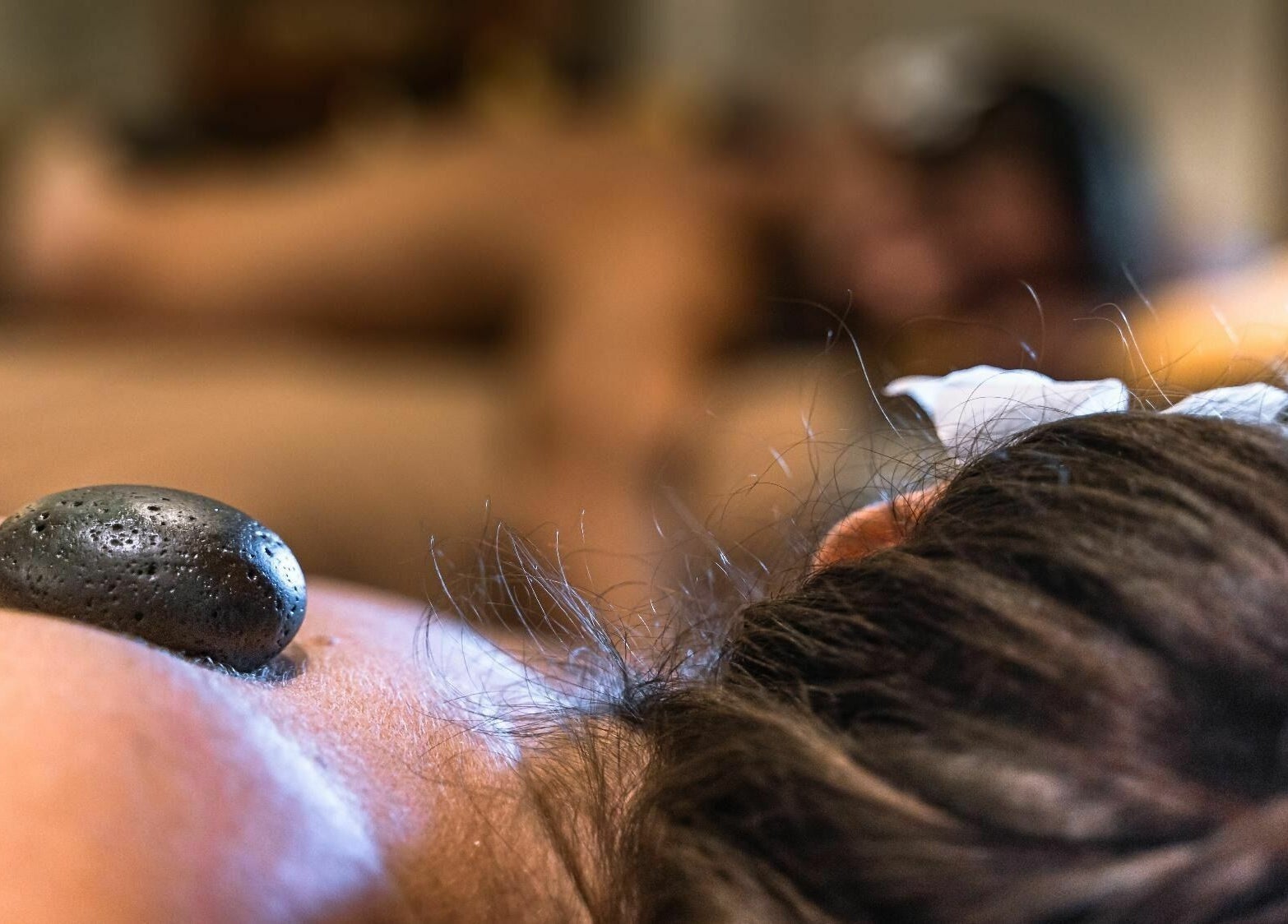 Hot stone treatment at Laniakea Spa, Bali, Bali, ID offering relaxation and rejuvenation services.