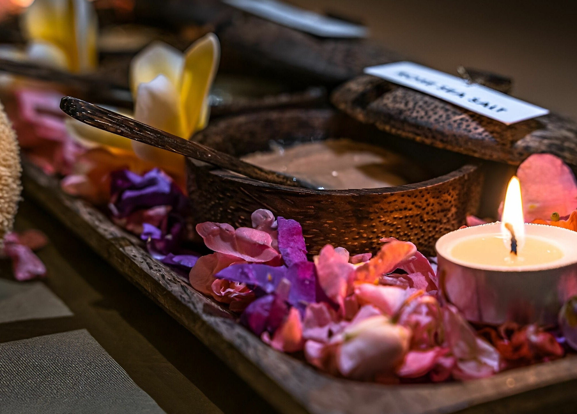 Candles and flower petals at Laniakea Spa, Bali, Bali, ID create a serene and relaxing ambiance.