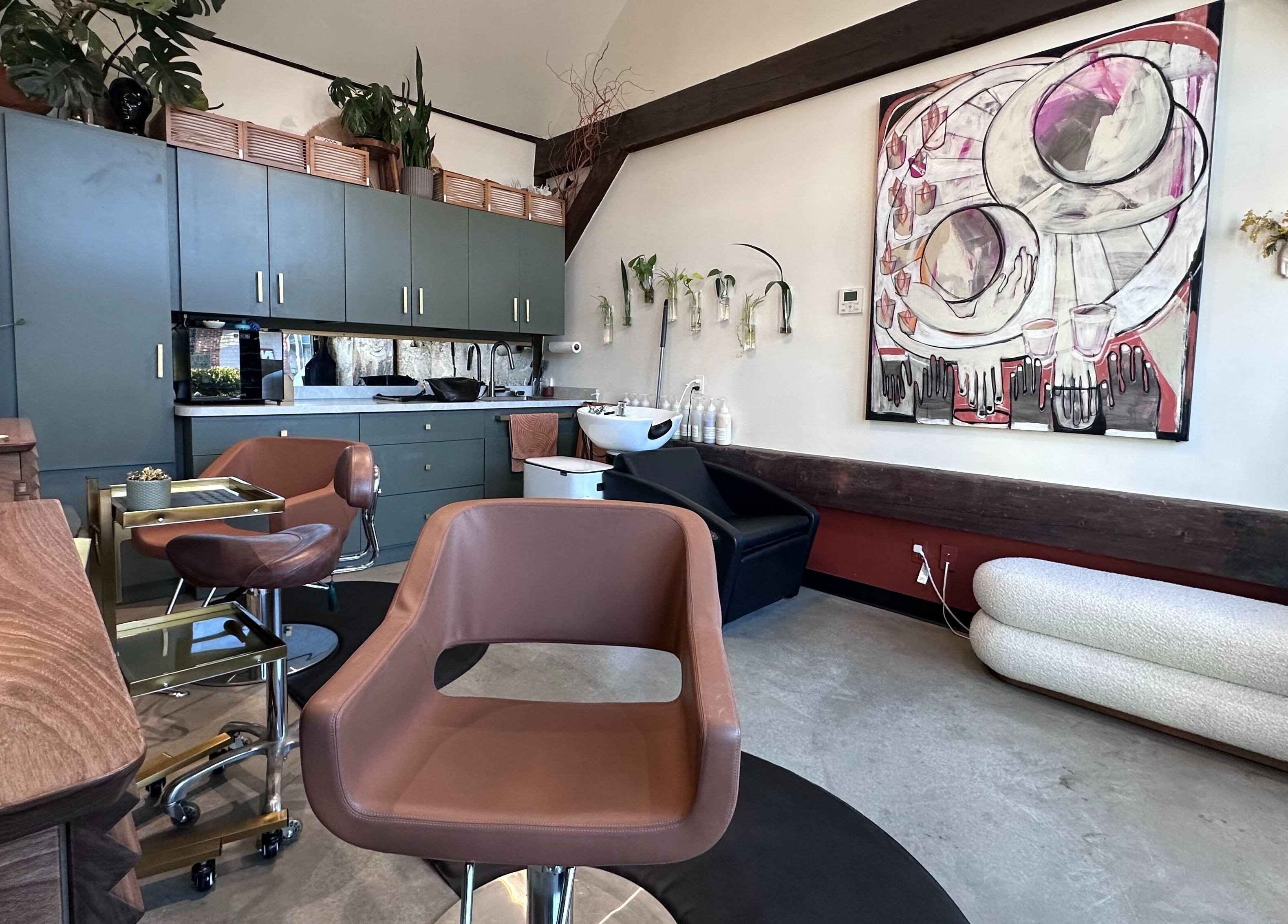 Stylish interior of Bellwether Salon, Boston with modern chairs and art. Serene beauty space in Massachusetts, US.