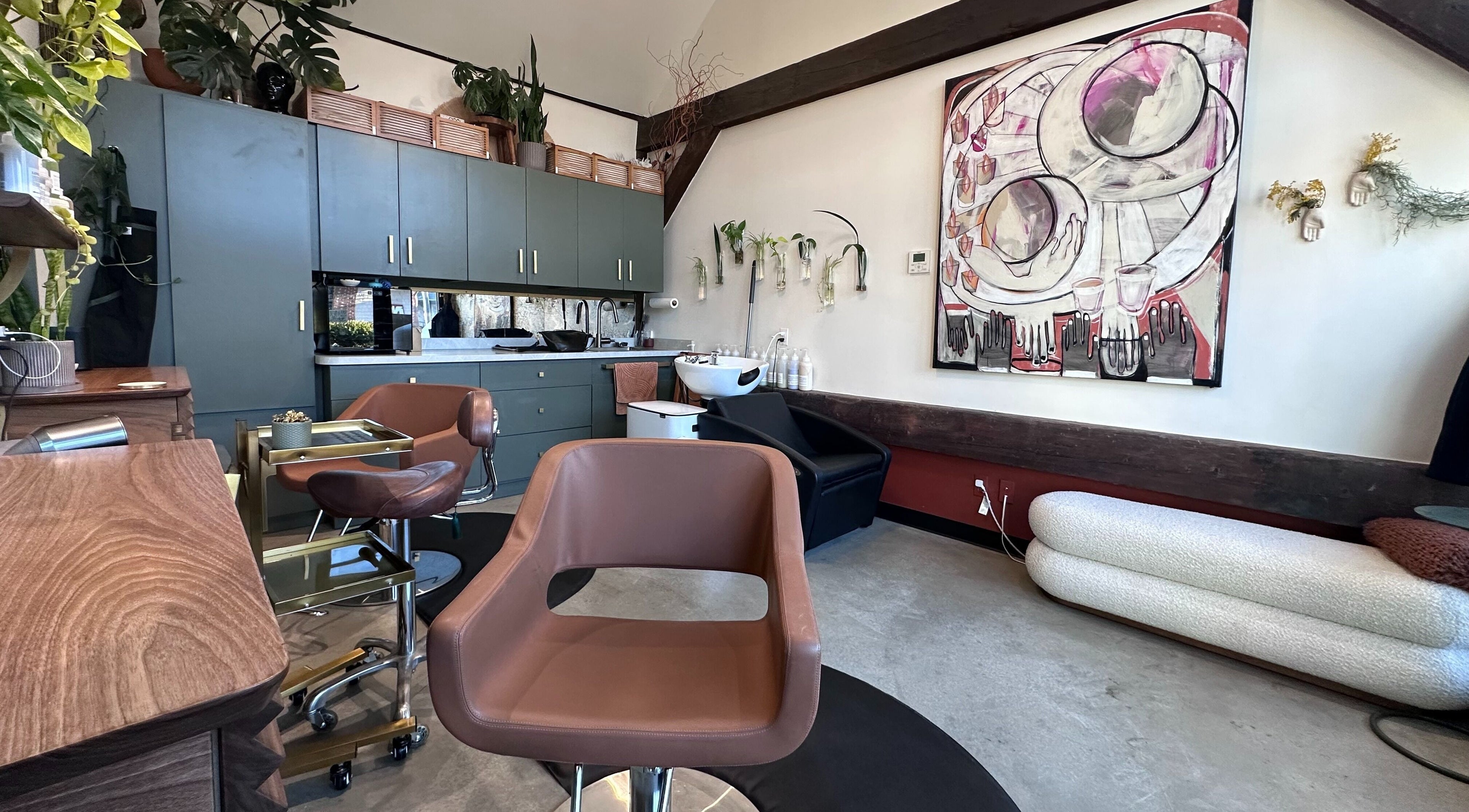Stylish interior of Bellwether Salon, Boston with modern chairs and art. Serene beauty space in Massachusetts, US.