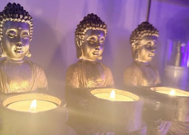 Serene Buddha candle holders at Butterfly Beauty, Longridge, England, GB, creating a calming ambiance.