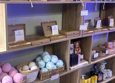 Shelf with beauty products and gift boxes at Butterfly Beauty, Longridge, England, GB.