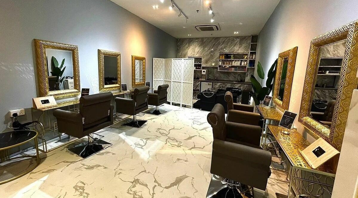 Luxurious interior of Guzel Salon in Singapore, SG, featuring stylish chairs and ornate mirrors.