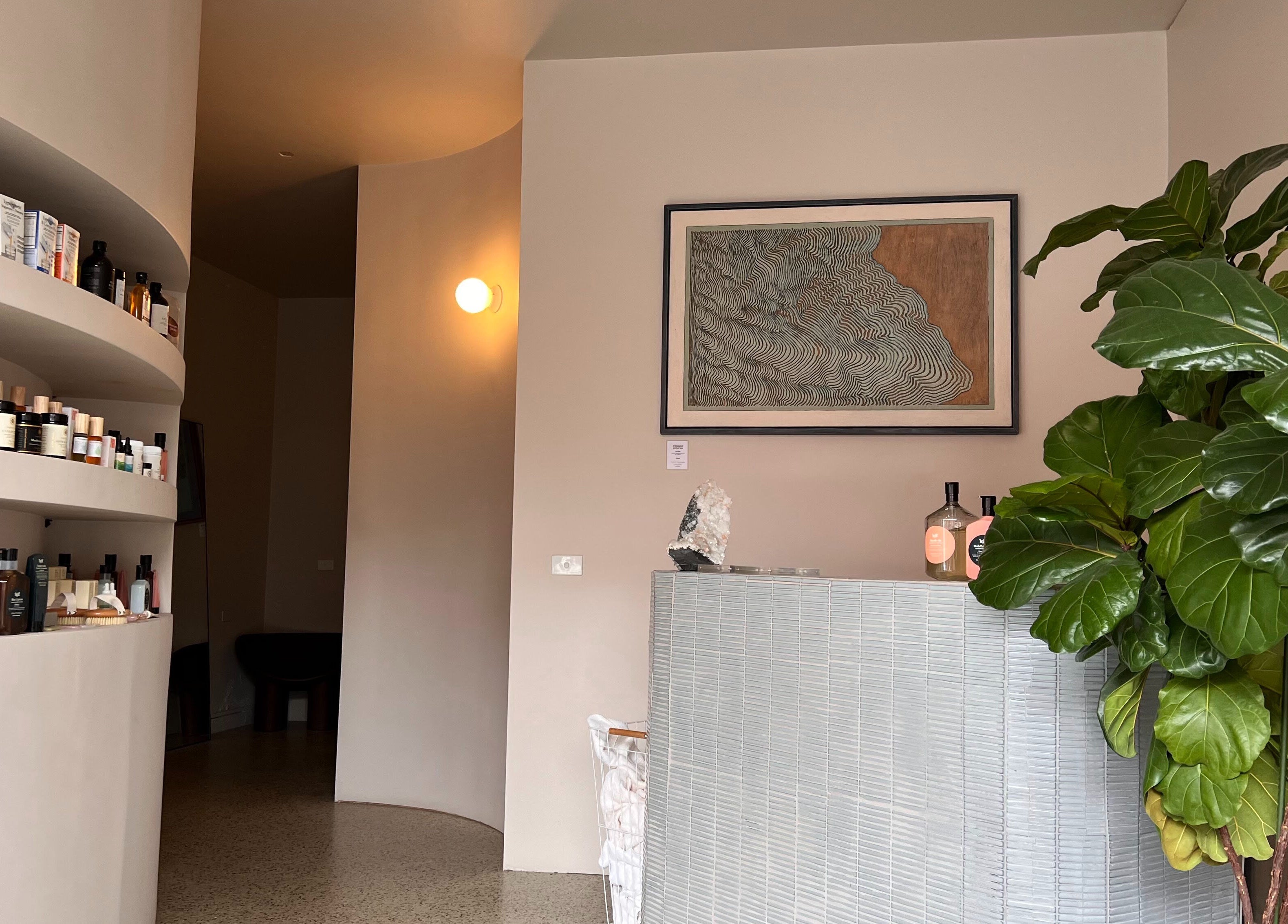 Elegant reception area at Nimbus Co Richmond, Richmond, Victoria, AU featuring lush greenery and sleek design.