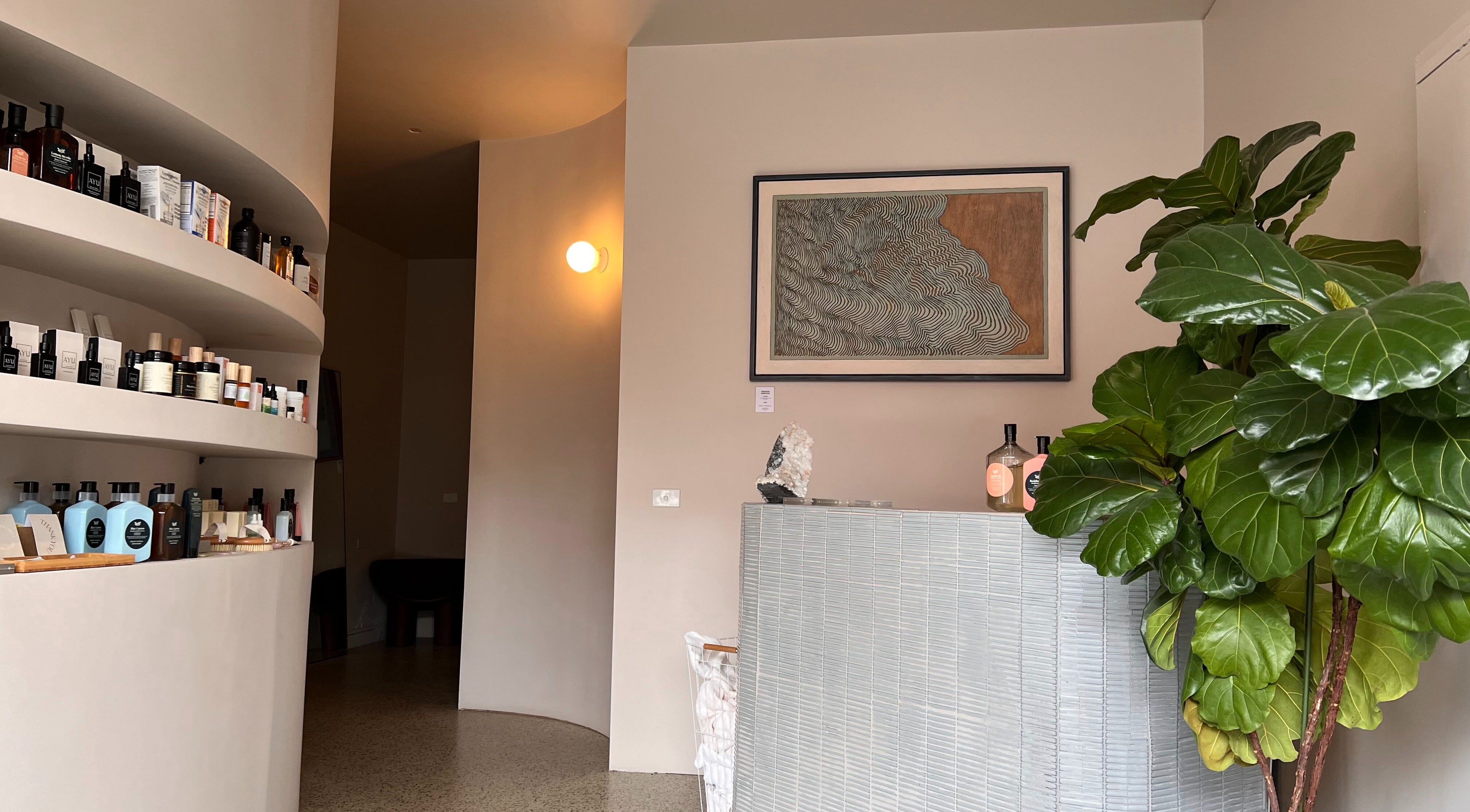 Elegant reception area at Nimbus Co Richmond, Richmond, Victoria, AU featuring lush greenery and sleek design.