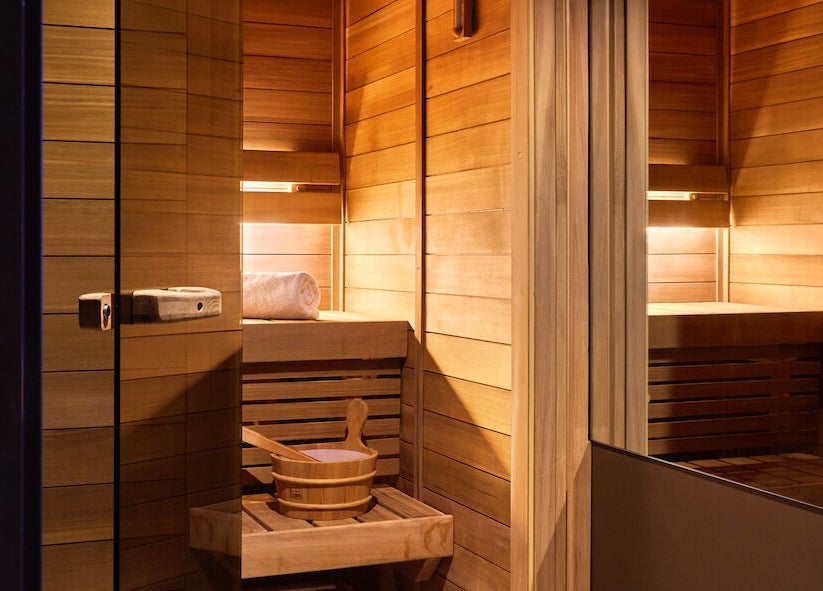 Cozy wooden sauna interior at Nimbus Co Fitzroy, Melbourne, Victoria, AU, offering a relaxing wellness experience.