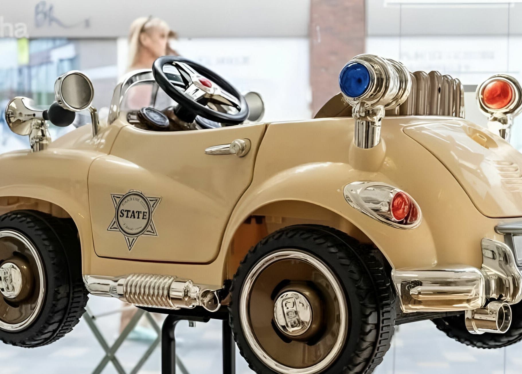 Elegant vintage-style toy car at Beauty by Fabi, Camberley, England, GB, enhancing playful decor.
