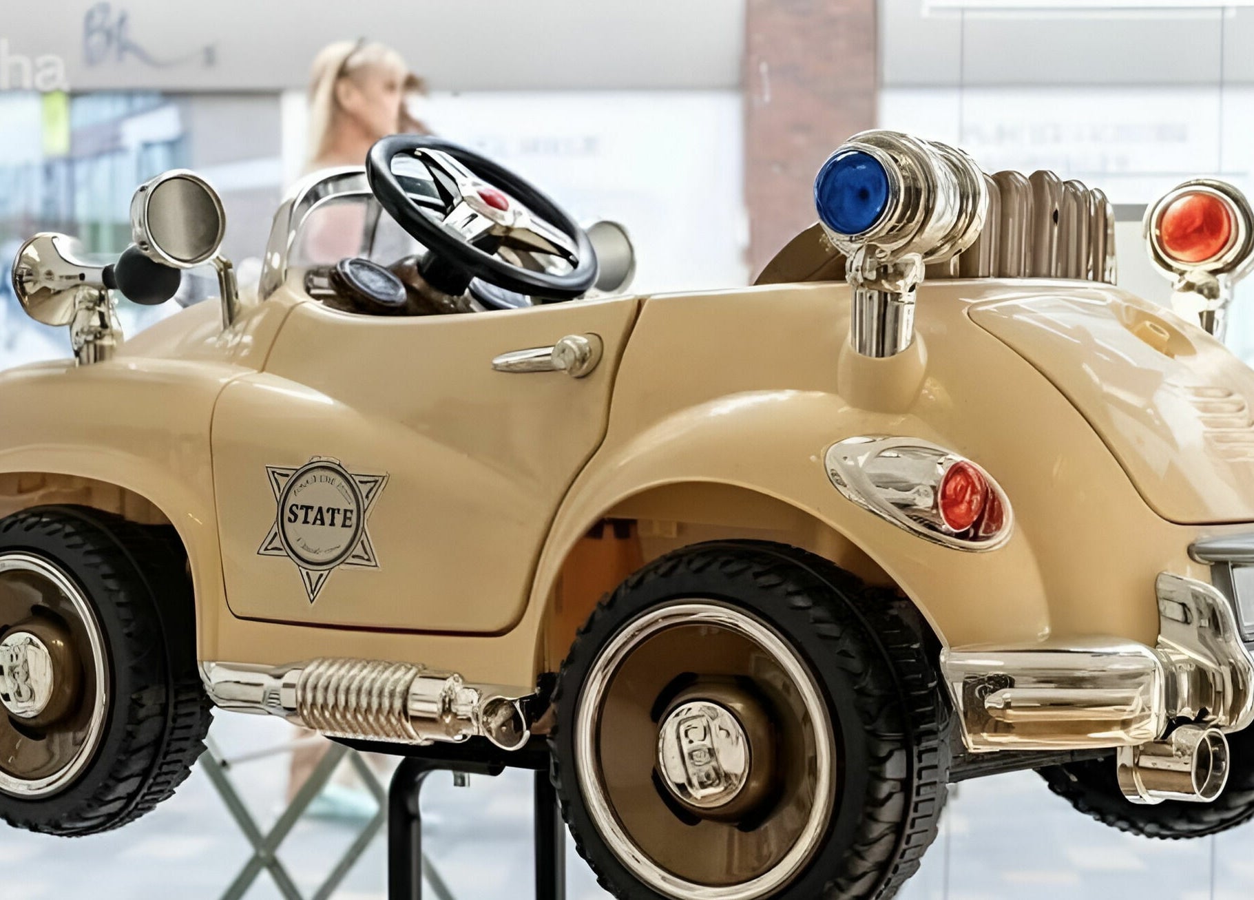 Elegant vintage-style toy car at Beauty by Fabi, Camberley, England, GB, enhancing playful decor.